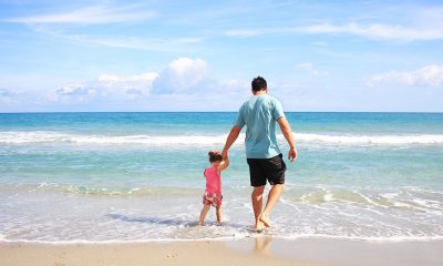 Fathers Day with dad and daughter on a beach